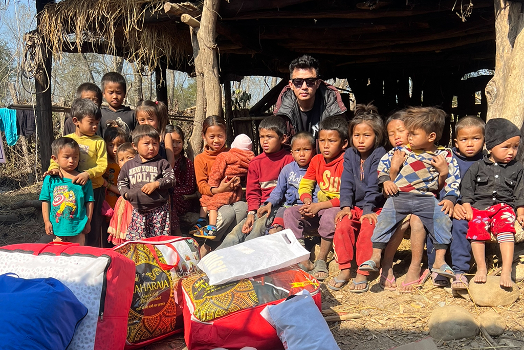 Rabindra with children from Chepang community