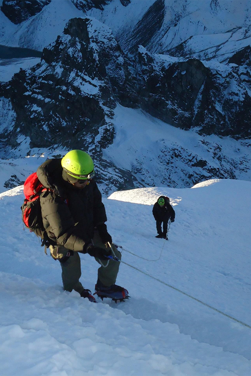 Rabindra climbing snowy mountain